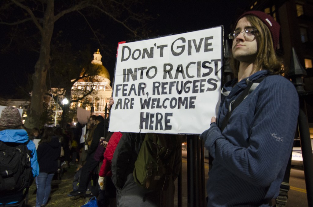 BOSTON, 20th Nov 2015: Locals rallied against Governor Baker's position on Syrian refugees outside the Massachsetts State House on the Boston Common Friday. (Photo by: Nikita Sampath)