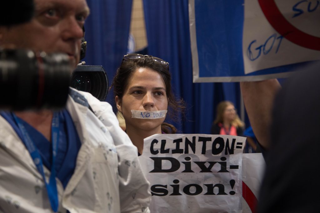 A protestor with her lips tape in protest of the nomination of Hillary Clinton isnide the Wells Fargo Arena in Philadelphia on Tuesday. Photo by Pankaj Khadka