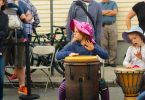 Parents and their kids play drums during Drums and Wellness session at the 2018 Fluff Festival. Somerville, Mass. September 22, 2018. Photo by Diego Marcano / BU News Service.