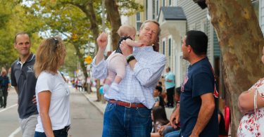 Governor Charlie Baker greeted people at the Columbus Day Parade in East Boston, on Sunday, Oct. 7. Photo by Flaviana Sandoval / BU News Service