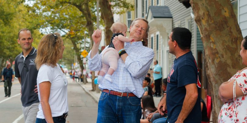 Governor Charlie Baker greeted people at the Columbus Day Parade in East Boston, on Sunday, Oct. 7. Photo by Flaviana Sandoval / BU News Service