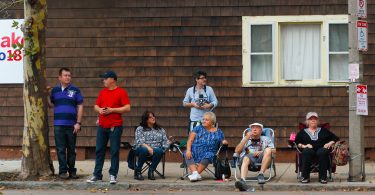 Families gathered on along Chelsea Street to watch the Columbus Day Parade in East Boston, on Sunday, Oct. 7. Photo by Flaviana Sandoval / BU News Service