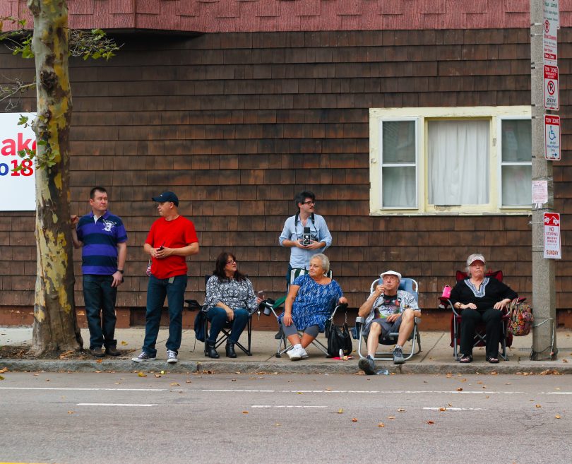 Families gathered on along Chelsea Street to watch the Columbus Day Parade in East Boston, on Sunday, Oct. 7. Photo by Flaviana Sandoval / BU News Service