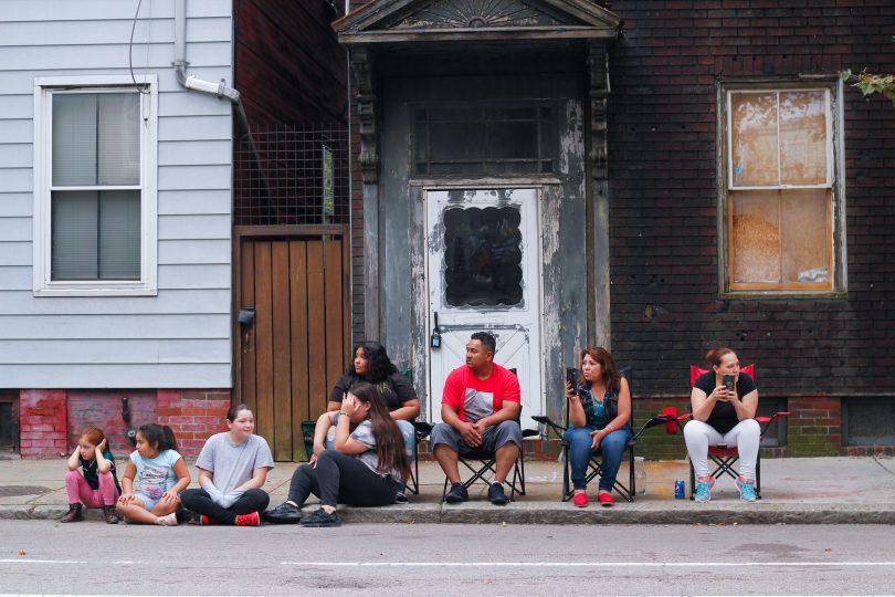 Families gathered on along Chelsea Street to watch the Columbus Day Parade in East Boston, on Sunday, Oct. 7. Photo by Flaviana Sandoval / BU News Service