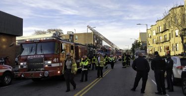 Boston Police and Fire Department officers block the street after a partial roof collapse at Common Ground Bar & Grill in Allston, Nov. 4. Photo by Aaron Ye / BU News Service.