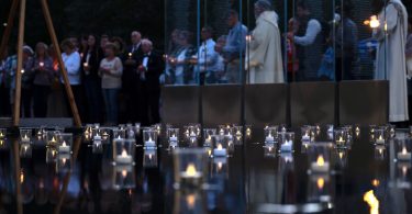 People gathered at the Massachusetts Fallen Heroes Memorial