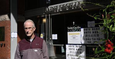 Voter in front of the polling station at Saint Cecilia Parish