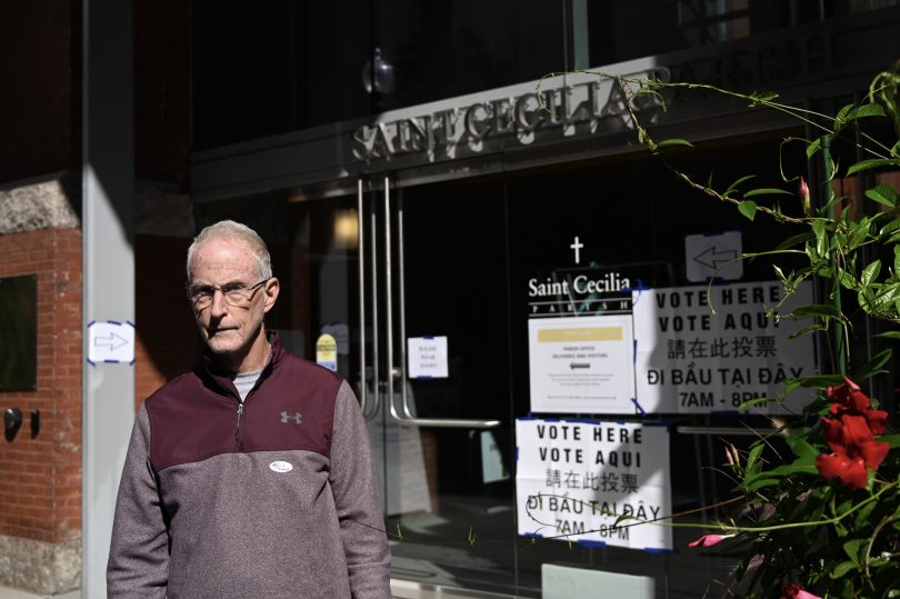 Voter in front of the polling station at Saint Cecilia Parish